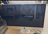 Front view of 2011 Apple iMac 27-inch screen and aluminum body.