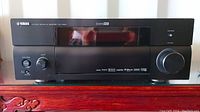 Front view of Yamaha RX-V1800 AV receiver showing display and control knobs.