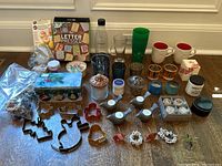 Full lot overview including all cookie cutters, cups, candle holders, and small decor items.