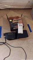 Nikon Monarch Laser 800 rangefinder with nylon carrying case and original box on the floor.