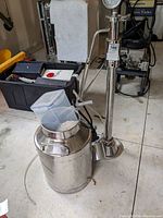 Full view of pressure pot, regulator stand, hoses and motor assembly