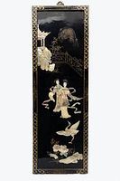 Image of entire black lacquered panel with mother of pearl figures and decorative gold border