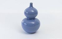 Full view of the double gourd-shaped vase with a smooth blue glaze