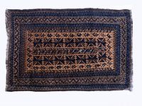 Full top view of the small Belouche rug showcasing the entire geometric pattern and color combination of dark blue, gold, and brown.