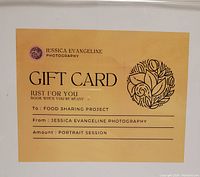 Photo of the gift card issued by Jessica Evangeline Photography for a portrait session.
