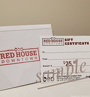 Photo showing $25 gift certificate card from Red House Downtown beside a white envelope with Red House Downtown stamp.