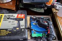 Two drills including the Wagner cordless drill and the Skil Slugger power drill, both with boxes and power cord for Skil drill visible.