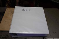White 3-ring binder labeled 'Russia' on cover, showing condition and type of album.