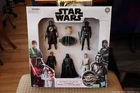 Star Wars action figure set in original packaging showing all six figures and accessories.