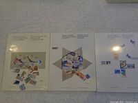 Photo showing all three unopened Souvenir Collections of Canadian postage stamps for years 1986, 1987, and 1988 arranged side by side.