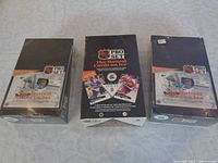 Three unopened boxes of 1991-92 Pro Set Hockey Cards, two Series 1 and one Series 2, on a light-colored surface.