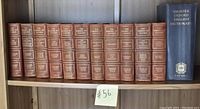 Complete 12-volume Morang Makers of Canada book set and one volume Shorter Oxford English Dictionary on a wooden shelf.