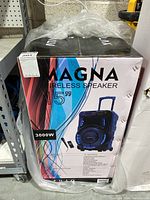Full boxed Magna wireless speaker system with 15-inch woofer, packaging showing front and specifications.