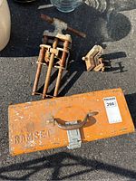 Ramset orange metal case, large screw clamp vise, smaller C-clamp style vise