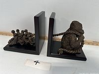 Both book ends shown side by side, displaying the gorilla resin figures and wood frames.