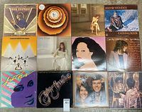 Overview photo showing all 10 vintage LP album covers arranged in three rows, showing a mix of artists including Bob Seger, Stevie Wonder, Carly Simon, Captain & Tennille, Carpenters, Linda Ronstadt, and Asha.