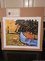 Full view of the unframed lithograph showing two deer by a stream in a brightly colored landscape with trees and flowers