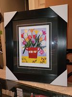 Full view of the framed fine art print showing protective corner covers on the frame edges.