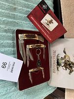 Full view of the Winchester 2003 limited edition knife set in collector's box with sleeve and instruction card