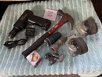Group image of all tools showing cordless drill, hammer, terminal cleaners, connectors, tape measure, and wheels