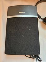 Bose SoundTouch 10 speaker front with mesh covering and logo.