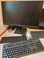 HP 21-inch monitor shown with its stand and HP keyboard in front.