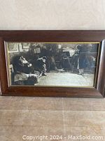 Full view of the framed lithograph showing the entire artwork depicting the classical scene with multiple figures seated in a room.