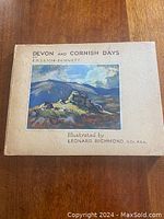 Front cover of the book 'Devon and Cornish Days' by E.P. Leigh Bennett showing a landscape painting illustration by Leonard Richmond.