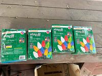 Four unopened boxes of Sylvania Stay-Lit 50 LED Christmas lights each, multi-colored bulbs illustrated on box, new in box condition.