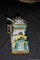 Porcelain jelly and cracker holder set, lid and spoon on black background