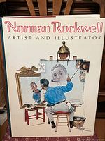 Front cover of the Norman Rockwell coffee table book showing detailed illustration of Rockwell painting himself.