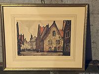 Framed picture of old house side view, showing the art and frame details