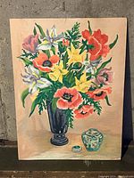 Photo of painting showing colorful bouquet of poppies and other flowers in a black vase, plus small greenish decorative container with lid on side.
