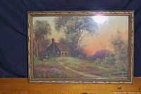 Photo of framed cottage sunset picture with trees and sunset sky
