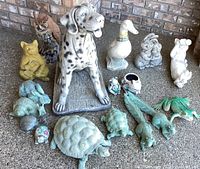 Overall group shot of all 17 yard art animal figurines showing a variety of animal types and sizes.
