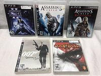All five PlayStation 3 game cases displayed side by side on a white surface, showing front cover art and titles.