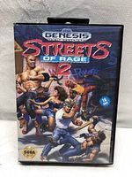 Front cover of the Sega Genesis Streets of Rage 2 game case showing colorful game art and Sega Genesis branding.