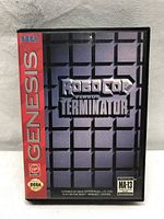 Front cover of Sega Genesis game case showing ROBOCOP Versus TERMINATOR title and Sega Genesis branding.
