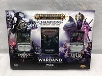 Front of sealed Warhammer: Age of Sigmar Champions Warband Pack Series 2 box showing Zarbag's Gitz and Eyes of the Nine cards with a booster pack in the middle labeled 'Savagery'.