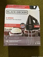 Box of the Black+Decker 6-speed hand mixer showing product details and features