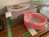 Four pink Mikasa Flamingo crystal bowls stacked showing the petal and swirl details, with Mikasa Crystal box in background
