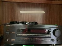 Front view of the Denon AVR-3200 receiver showing power button, headphone jack, digital display and control buttons.