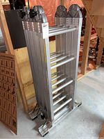 Folded ladder in storage position showing full height and rung spacing.