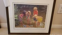 Full view of framed print depicting children at a pond.