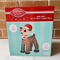 Front view of Rudolph Red-Nosed Reindeer airblown inflatable box showing the product image and details.