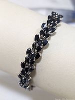 Section of bracelet showing clustered marquise sapphire arrangement