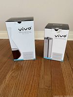 Boxed wine carafe and wine cooler from Vivo Villeroy & Boch Group placed on a wooden floor.