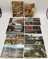 Photo showing 13 vintage 1970s postcards arranged in 3 groups on a white surface. Cards feature interiors of lounges, restaurants, exteriors of motels, and scenic views.