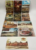 Photo of 13 vintage postcards laid out in three rows showing various scenes including restaurant interiors, outdoor views, food dishes, and a railroad station.