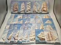 Array of multiple vintage postcards laid out in rows, showcasing detailed illustrations of different large sailing ships with multiple sails.
